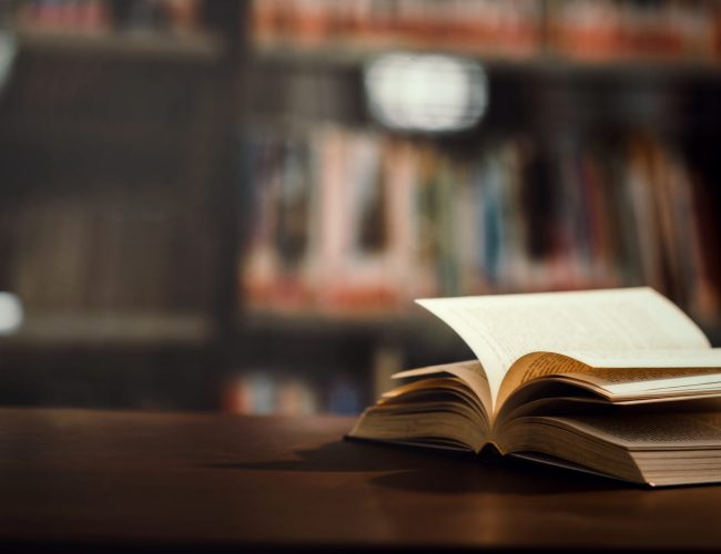 Book in library with open textbook,education learning concept